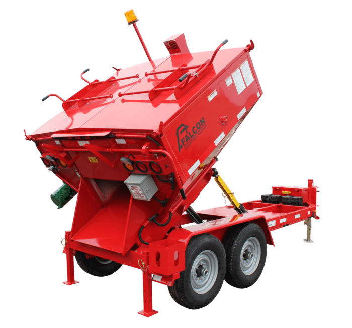 A red Falcon trailer-mounded asphalt repair machine