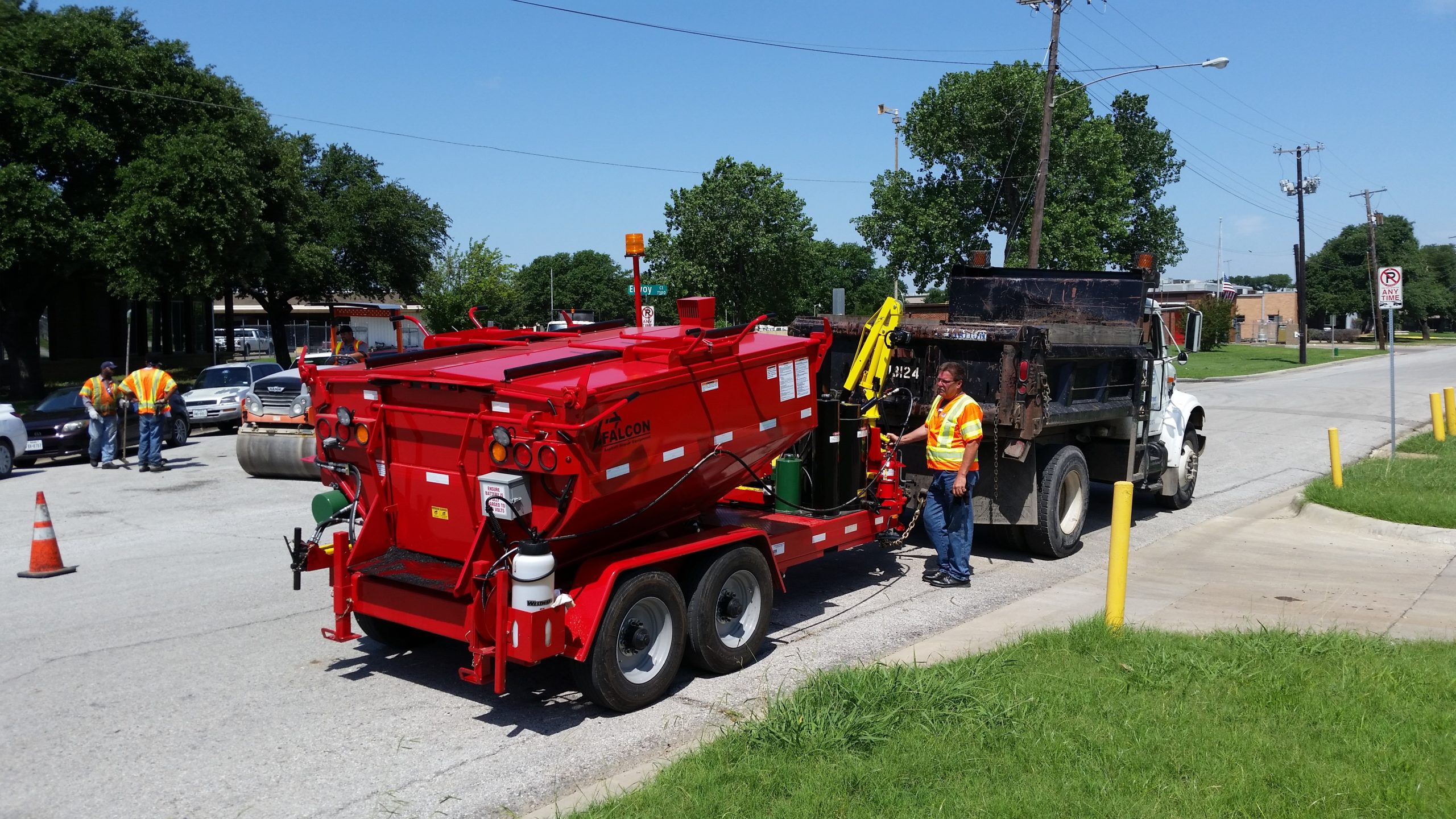 A Falcon crew getting ready to do a semi-permanent pothole repair technique.