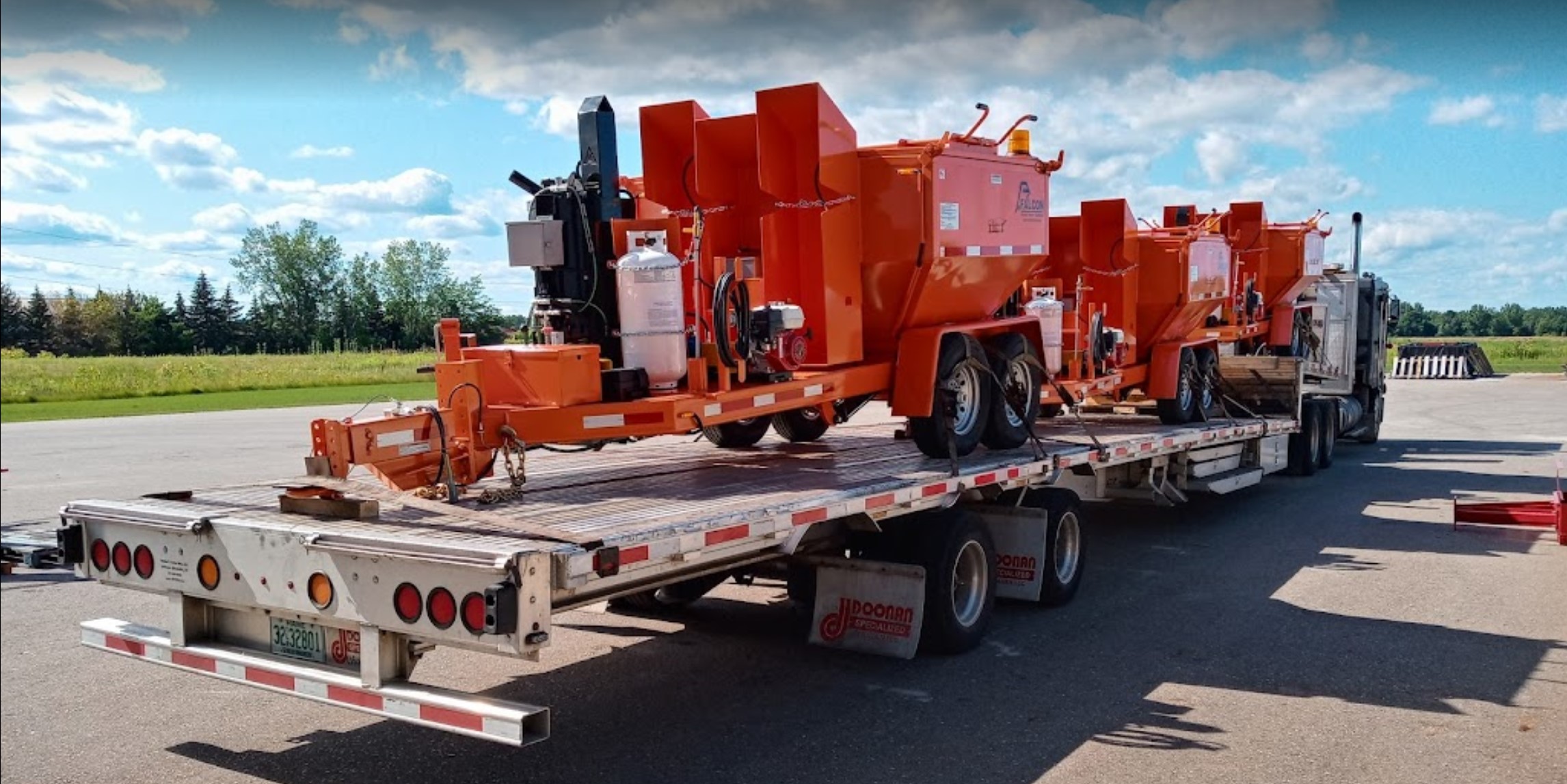 Falcon Asphalt repair equipment loaded on the back of a truck.