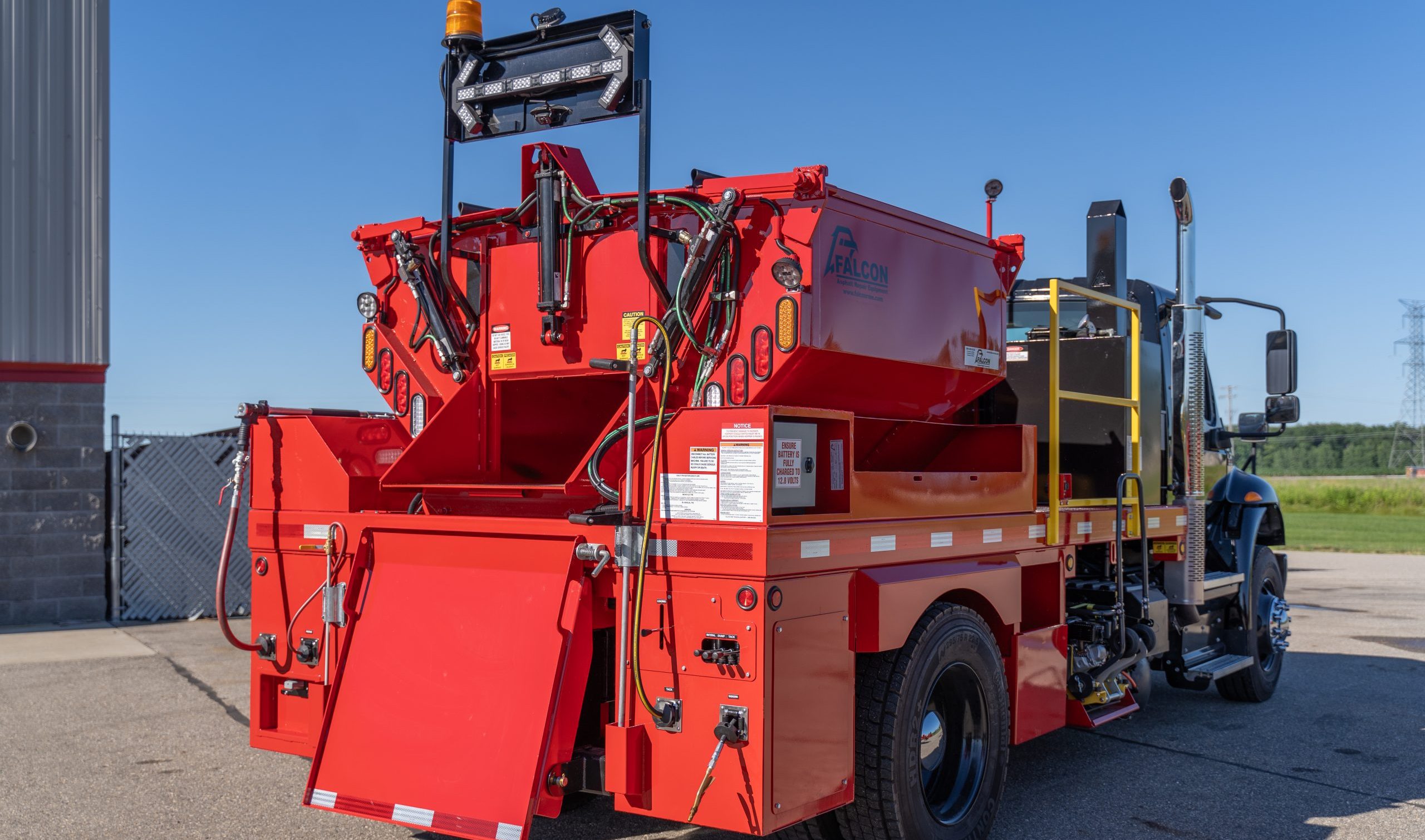 A Falcon asphalt patch truck.